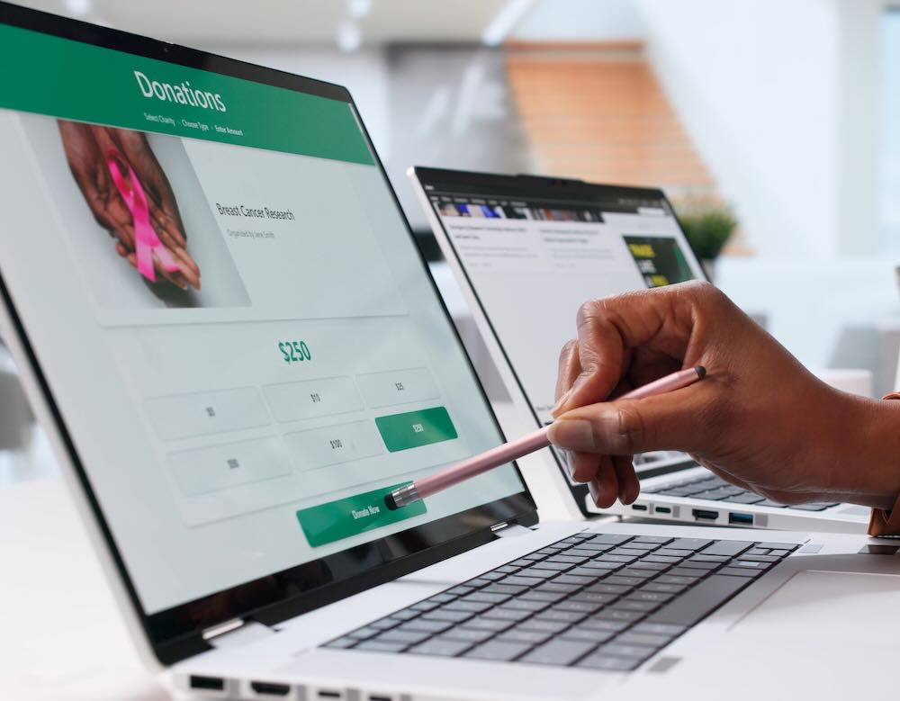 Person donating using their laptop